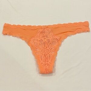 NEW WITH TAGS VICTORIA’S SECRET SIZE L CORAL/ ORANGE LACE AND SATIN THONG